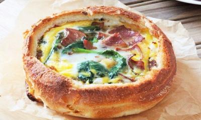 Bacon and Spinach Baked eggs In Bread Bowls